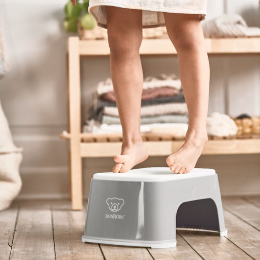 Person stepping onto a step stool in a home setting — BambiniJO Jordan