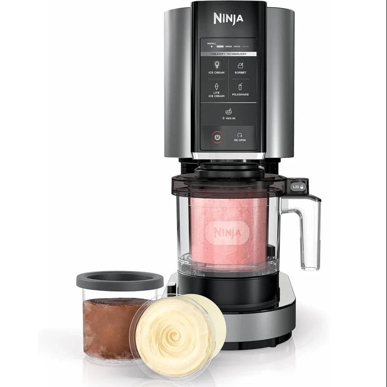 Ninja coffee maker with a pink drink inside on a white background