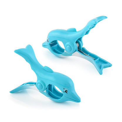 O2COOL Boca Clips Dolphin clipped to a lounge chair