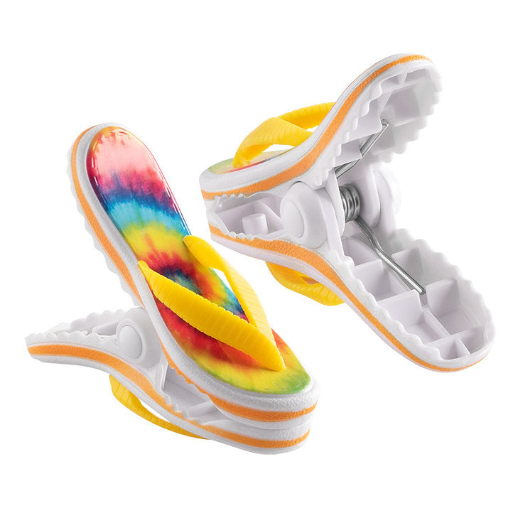 O2COOL Boca Clips Flip Flop Tie Dye clipped to a lounge chair