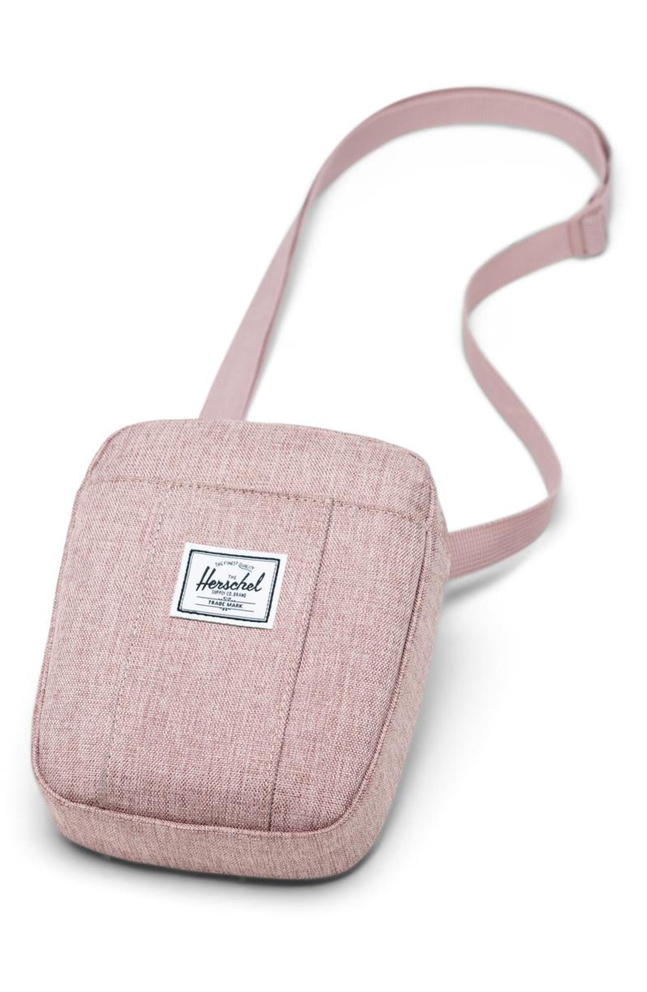 Herschel Cruz Crossbody Bag in Ash Rose Crosshatch, angled view with strap