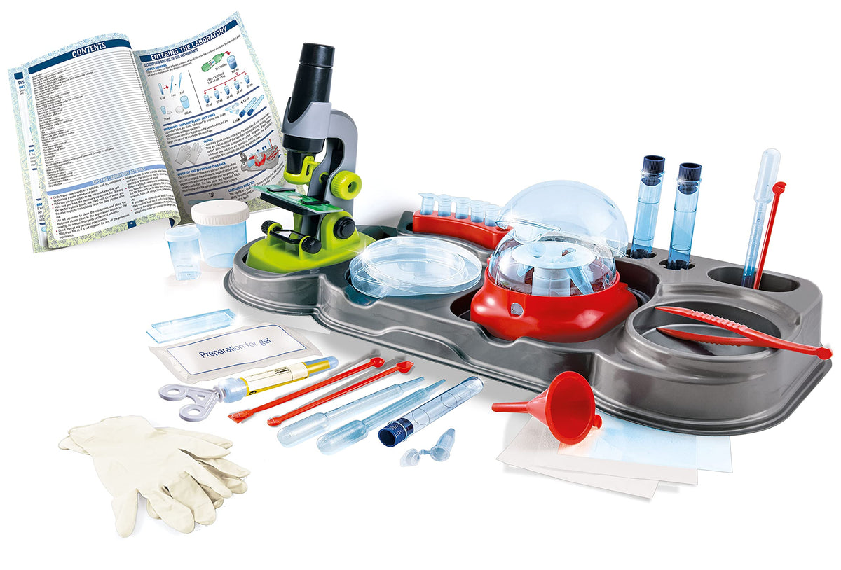 Clementoni Science in the Laboratory kit contents laid out: microscope, centrifuge, pipettes, manual