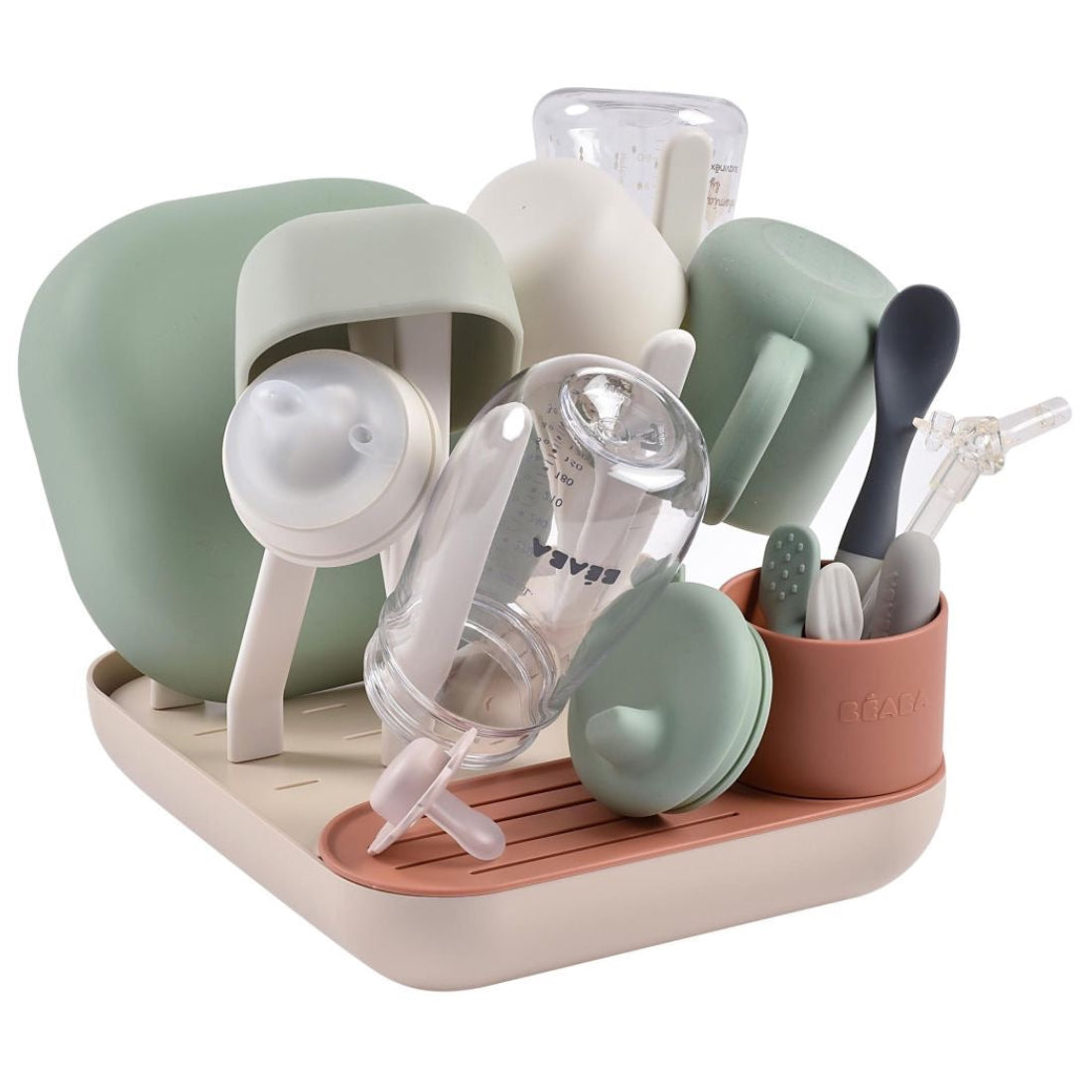 Set of baby feeding utensils and bottles on a white background