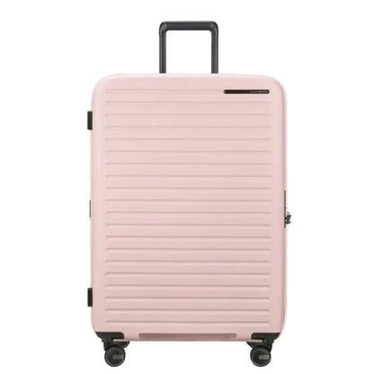 Pink suitcase with a textured surface on a white background