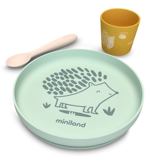 Children's dinner set with green plate, yellow cup, and wooden spoon on a white background