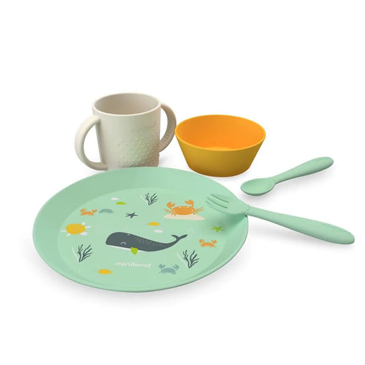 Children's dinner set with plate, cup, bowl, and fork on a white background