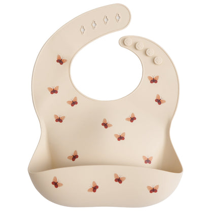 Beige baby bib with butterfly pattern on a white background