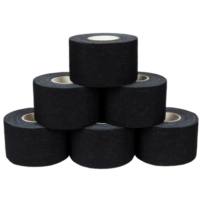 Six rolls of Kintex black cotton sports tape stacked