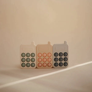 MUSHIE - Silicone Phone Press Toy | Blush - BambiniJO | Buy Online | Jordan